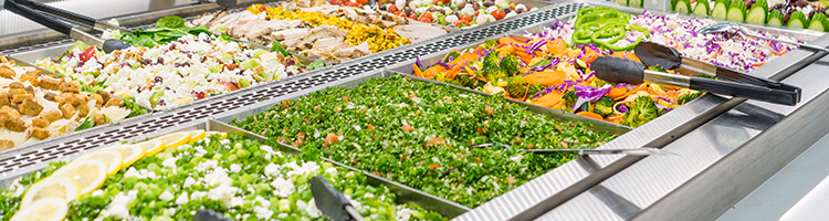 photo showing delicious salads in a hot bar